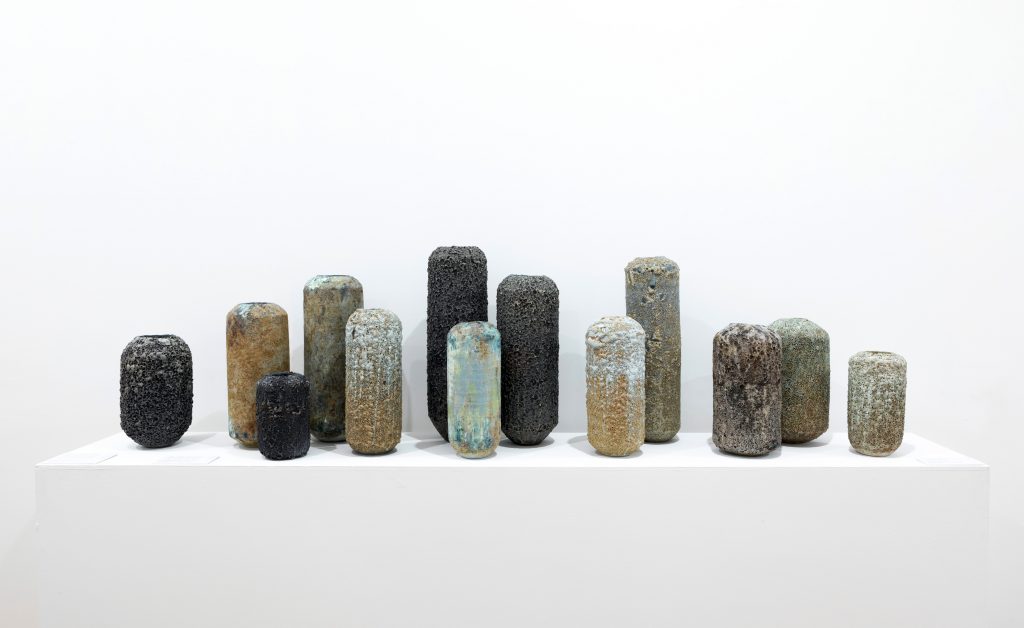Porcelain and stoneware Cylinders with tapered rims, displayed as part of Flux and Poise at Ruthin Craft Centre 2021